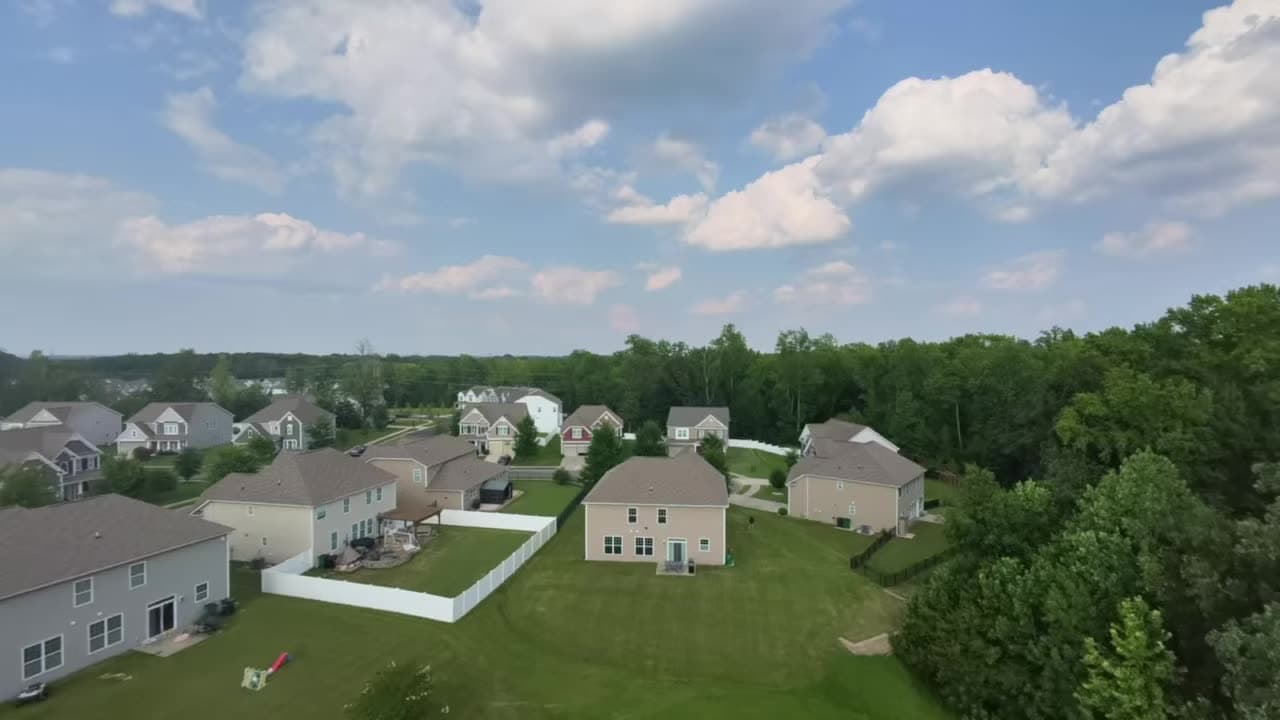 Aerial view of a QC Fence Contractors fence installation in a Charlotte-area neighborhood