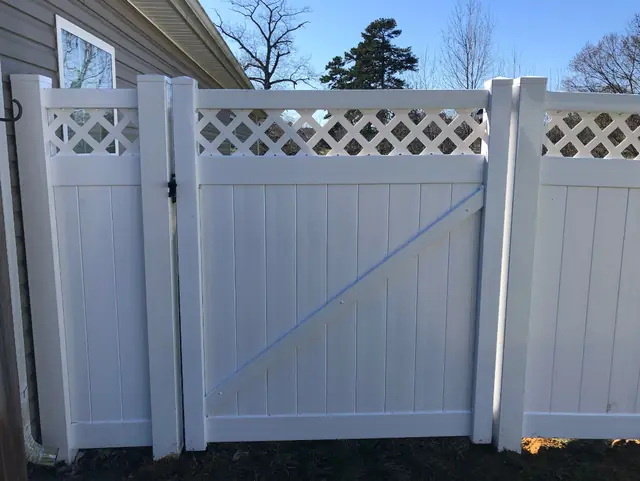 White vinyl gate with a lattice top.